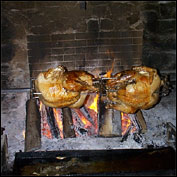 Two of the 38 turkeys roasting